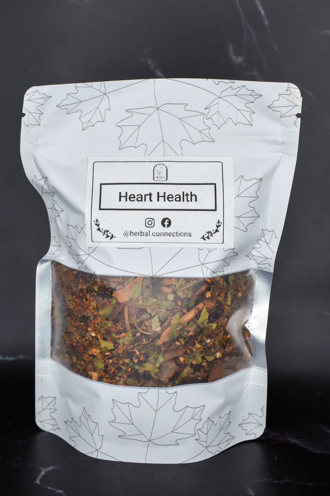 Loose-leaf blend with rooibos, hawthorn, hibiscus, and cinnamon in standing pouch packaging for heart health support